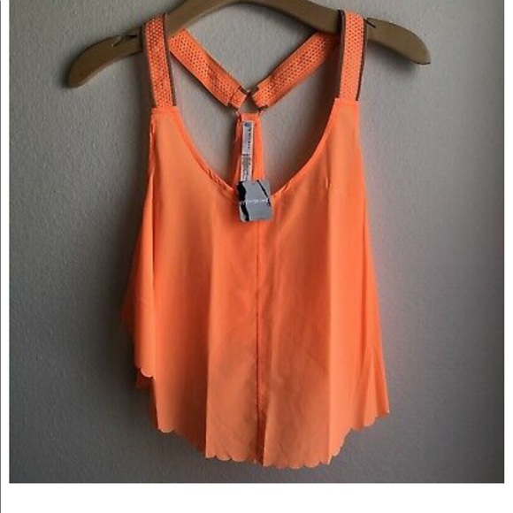 Free People Tops - NWT Free People Movement Pretty Lil Running Top. Size S. Color - Neon Mango.